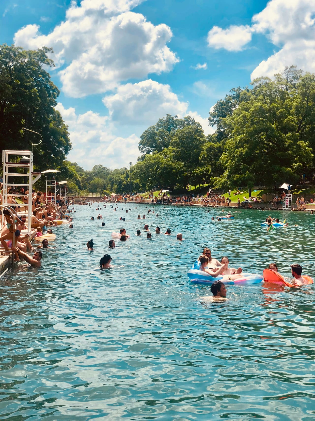 Swimmers at Barton Springs Pool in Austin on a summer day